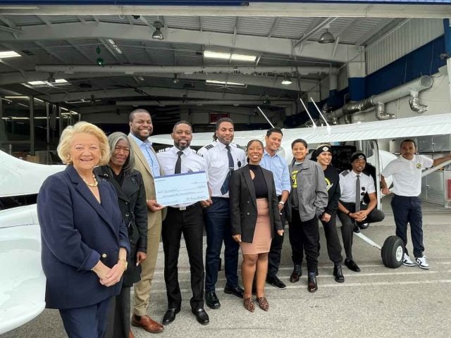 Boeing leaders present a check to Fly Compton. Funds will go toward flight training classes offered to underserved students in LA’s Compton community