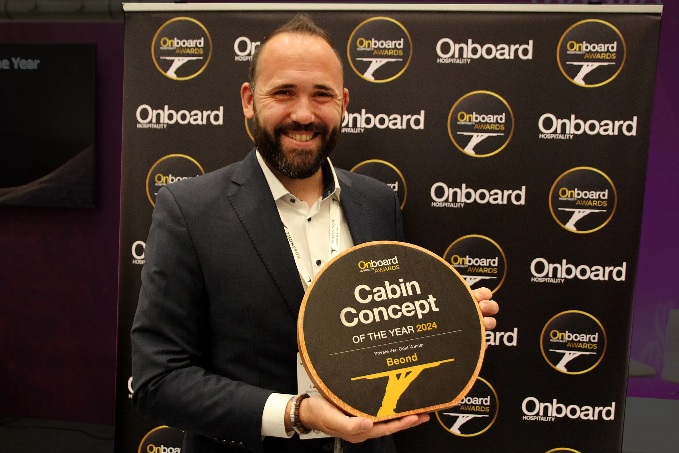 beOnd's head of sales in Europe, Lukas Hofmeister accepts the Cabin Concept of the Year award in Germany.